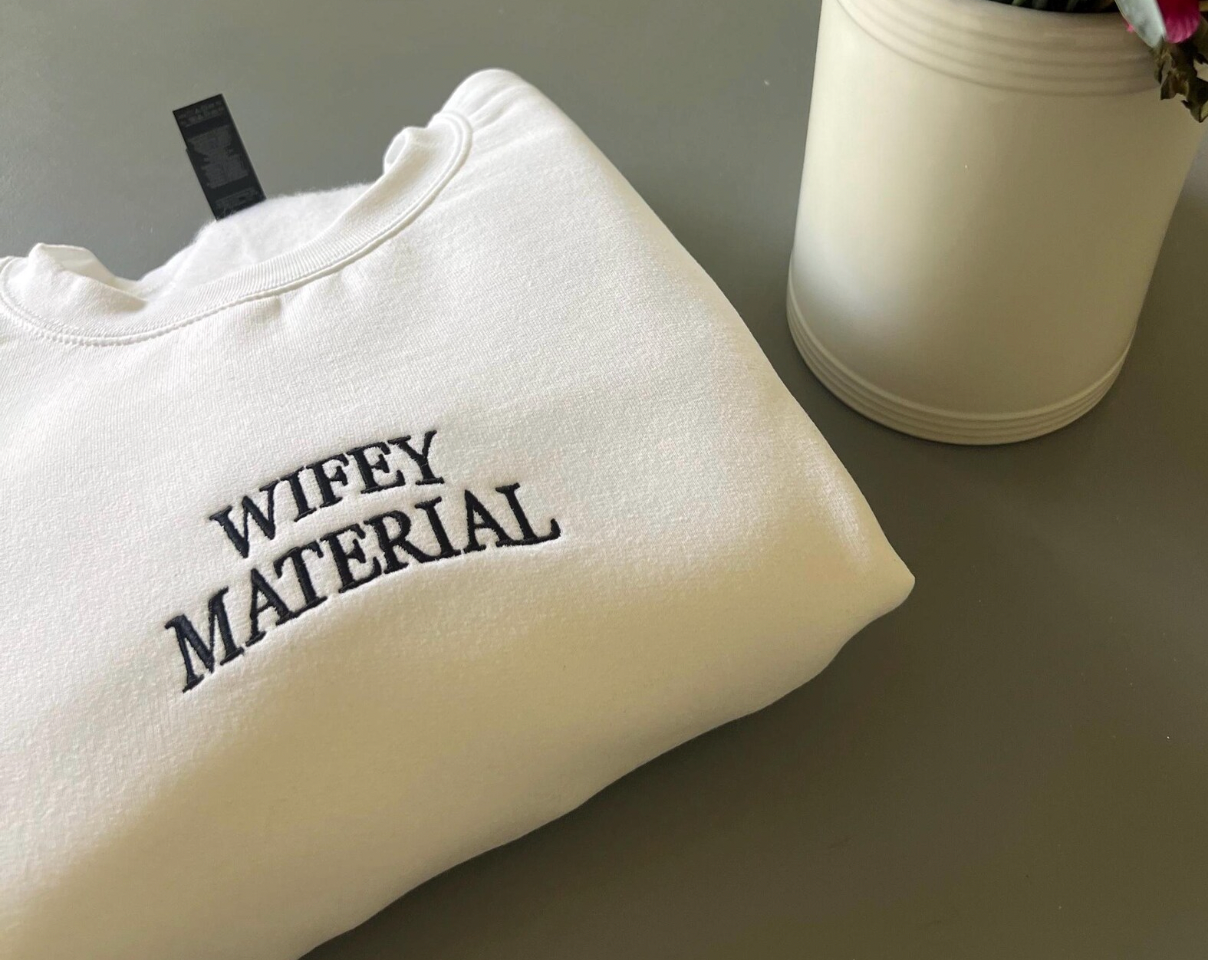 Wifey Material Embroidered Crewneck folded