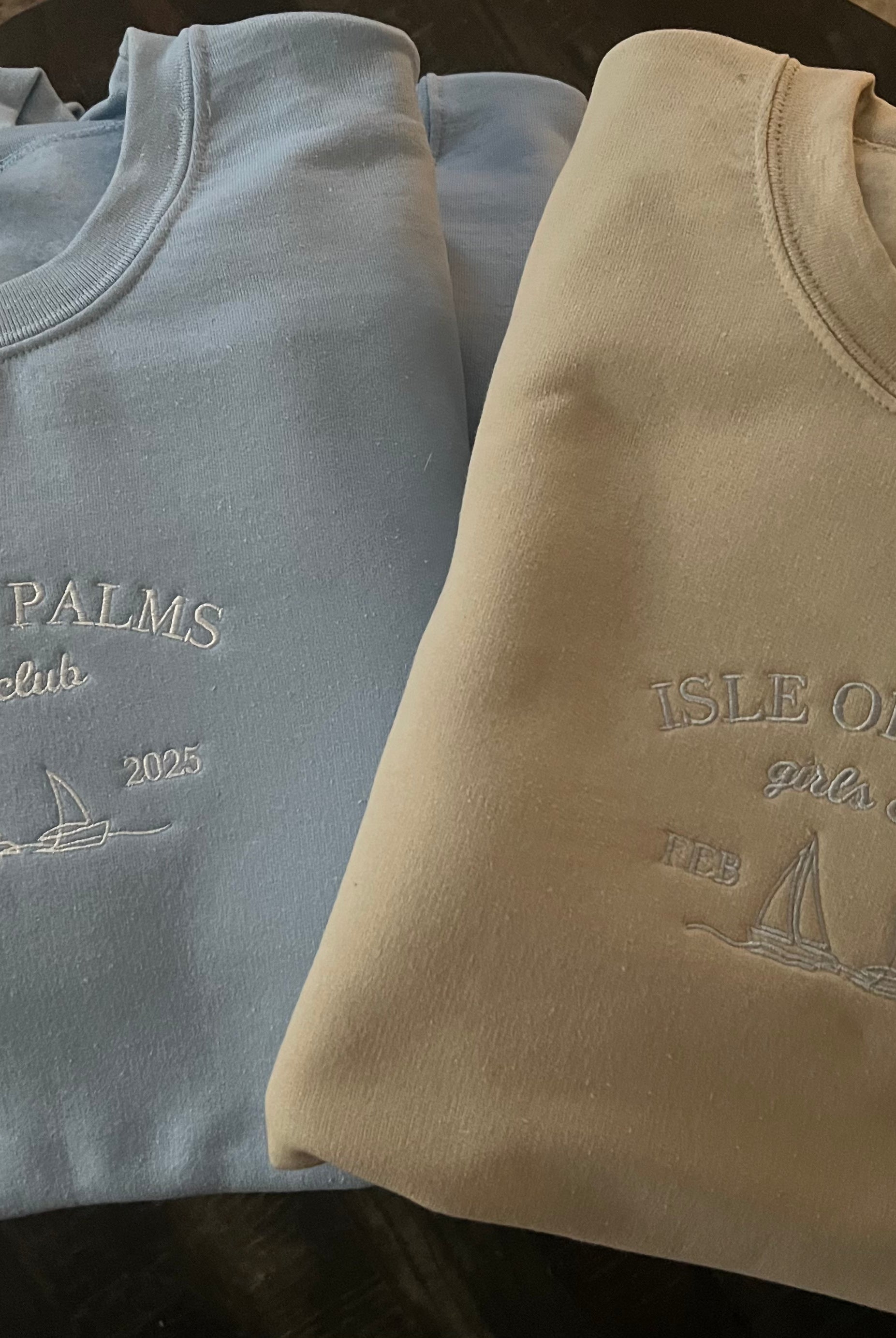 Sail Away: Custom Embroidered Sailboat Sweatshirts displayed