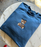 Blue Teddy Bear Embroidered Sweatshirt folded